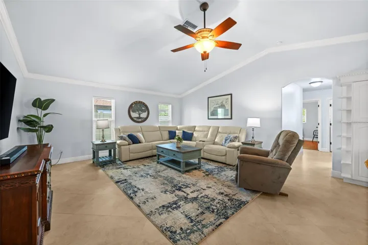 Family room with vaulted ceiling and crown molding