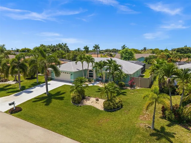 Mature landscaping throughout the large yard
