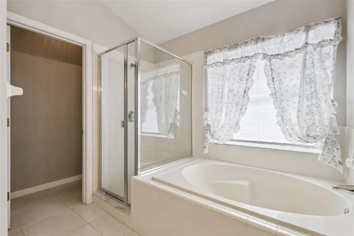 Master Bathroom w/ Soaking Tub, Walk-in Shower, and Private Water Room