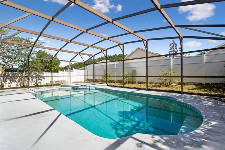 27 Foot Covered Lanai, Overlooking fully screened in pool