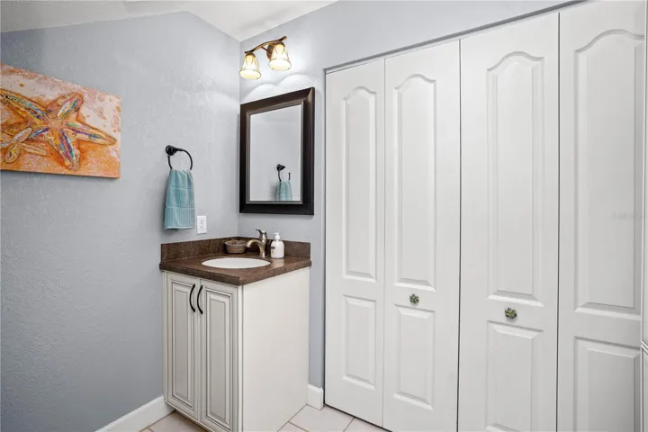 1st floor half bath with laundry in the closet