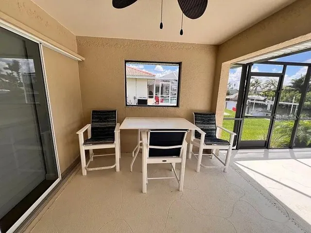 Covered patio poolside for a shaded retreat