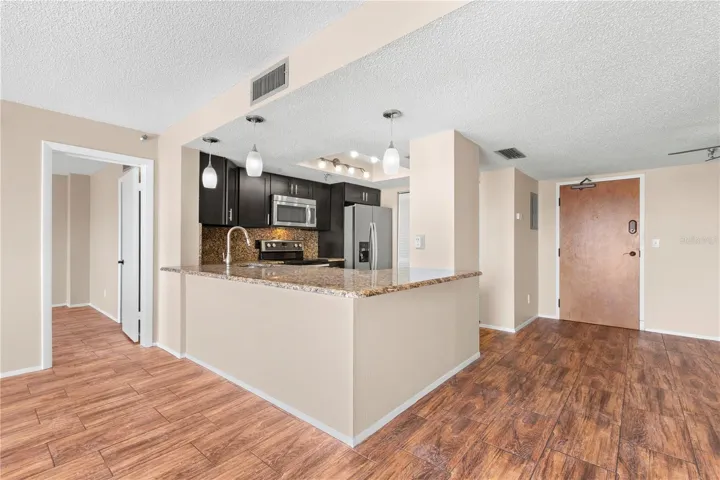 Now this is "Island Living"... granite counters, with space for added seating all around.