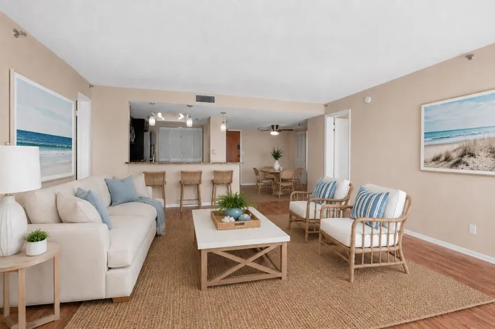 Open and spacious living. Looking into the dining and kitchen.... makes entertaining a breeze. Virtually Staged)