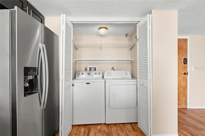 Private laundry closet in the kitchen.