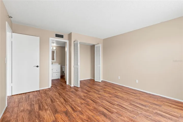 Bedroom Suite 2 with fill bath. Walk in shower, loo and single vanity.