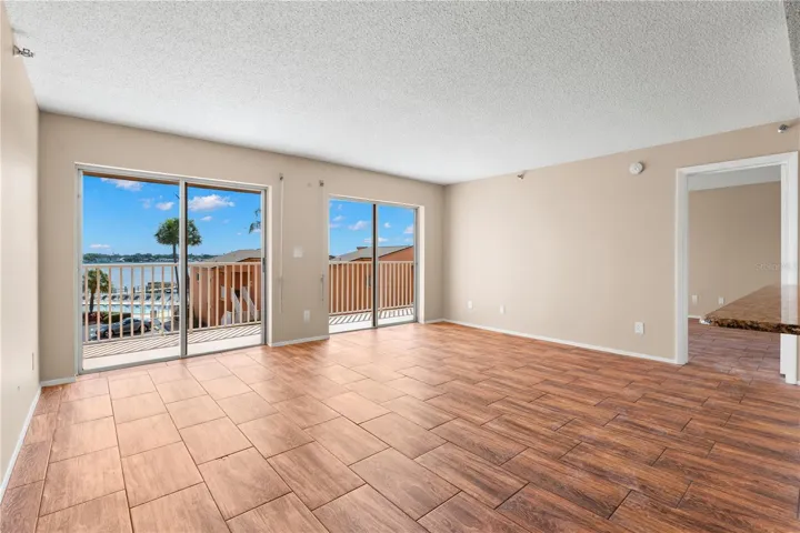 Living room with views of the pool and Tampa bay.