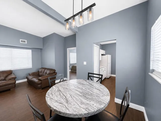 Dining Room with Living Room to the Left and the Kitchen to the Right.