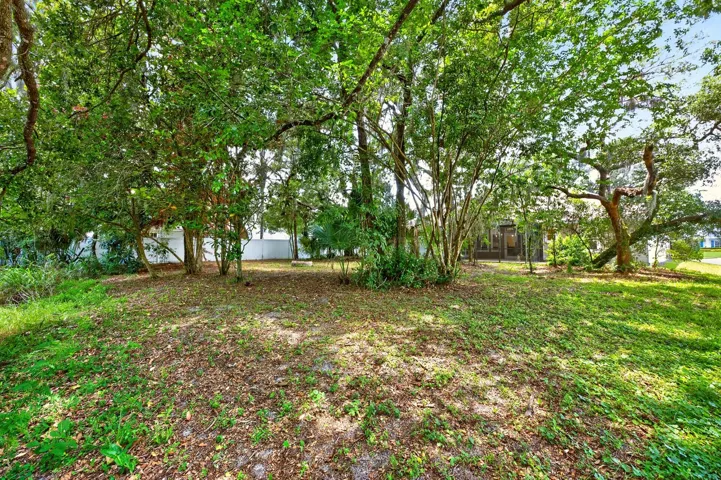 The mature trees add privacy to the large lot.