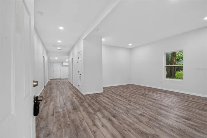 Entryway View of Main Hallway and Living Area
