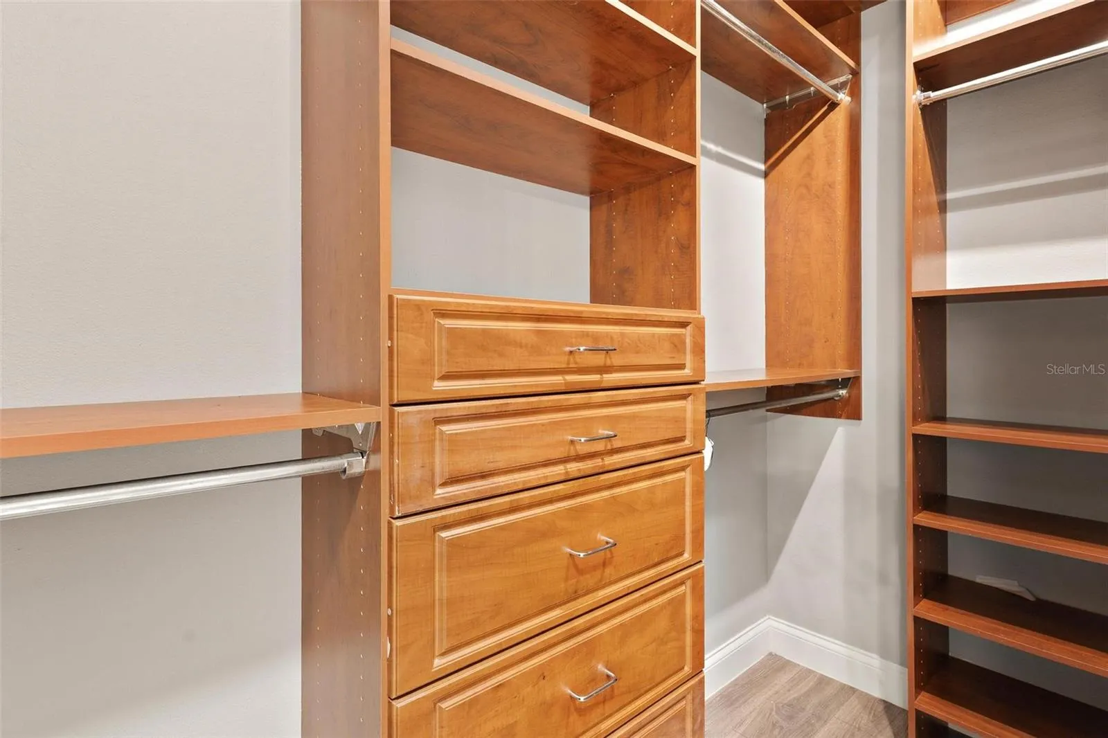 Primary Walk-In Closet with Custom Built-Ins