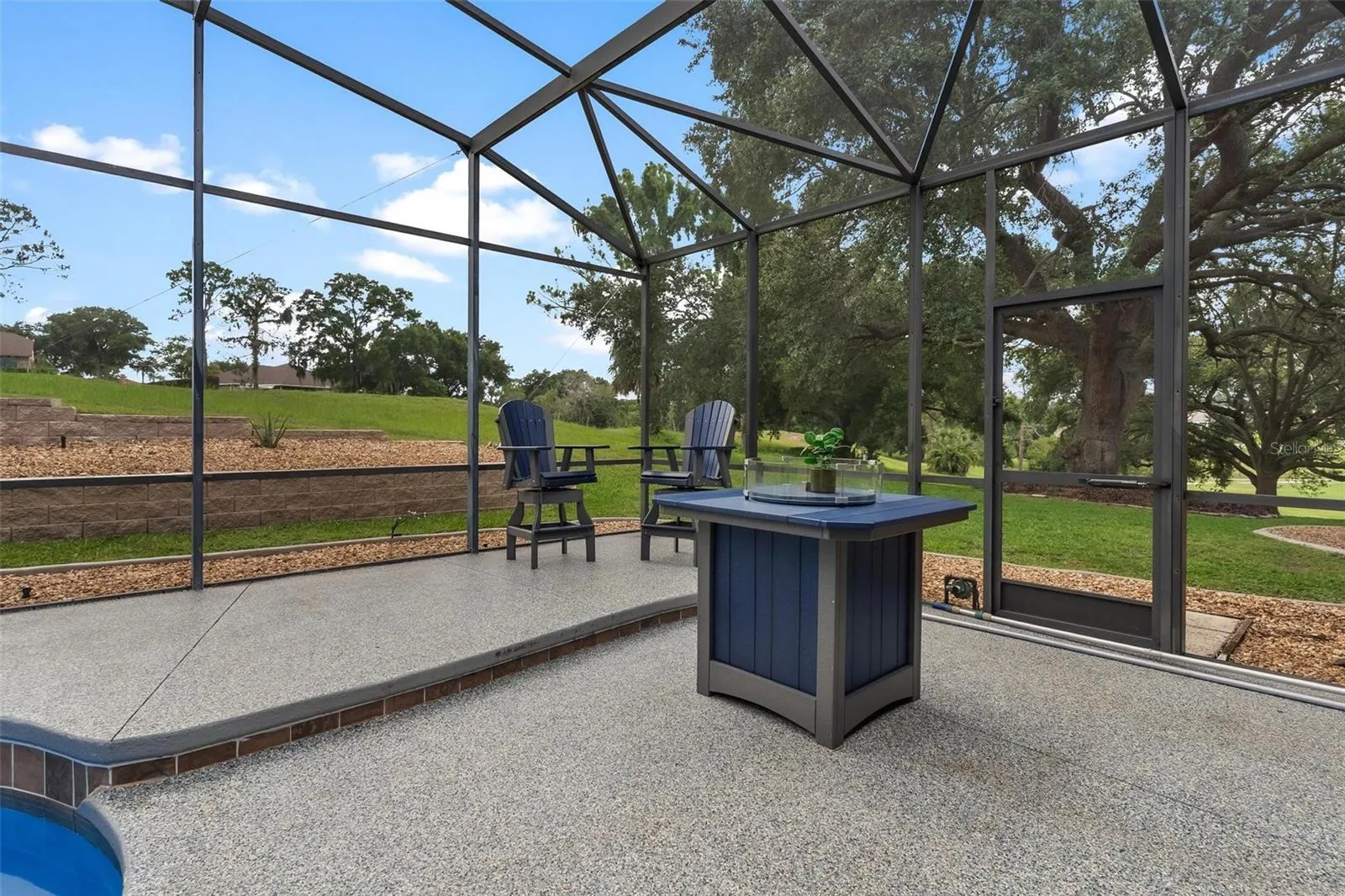The inviting firepit area is the perfect spot for evening conversations and outdoor enjoyment.