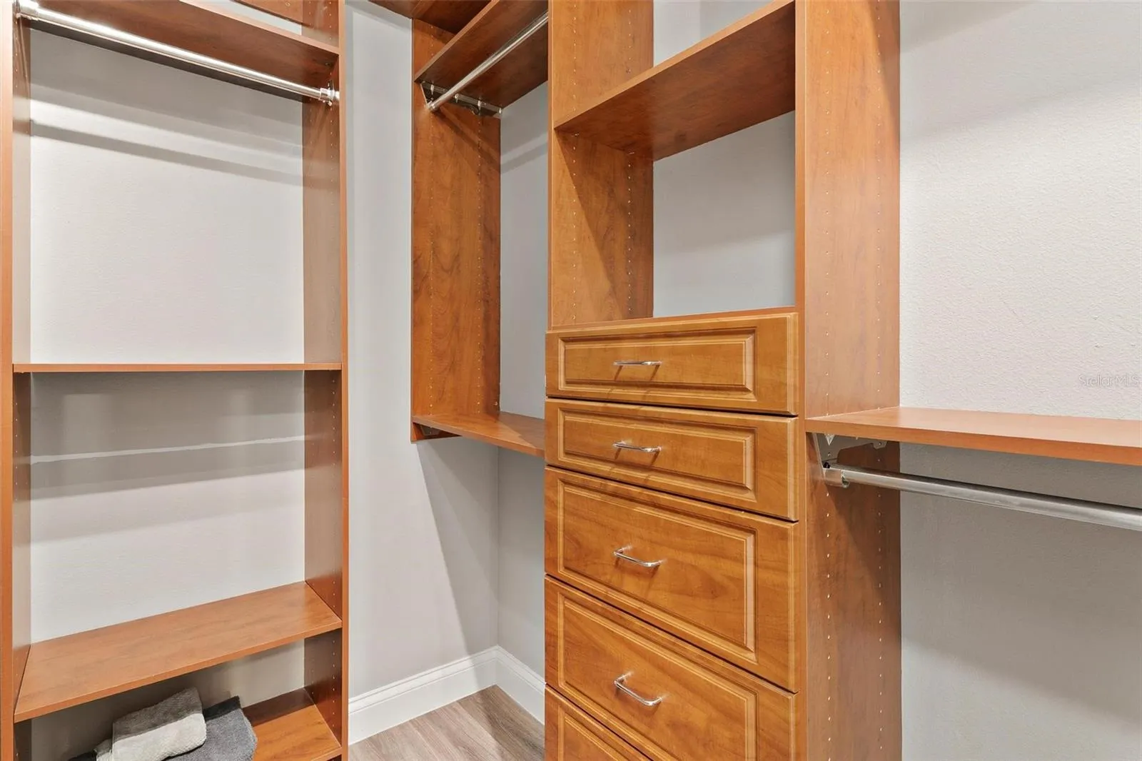 Primary Walk-In Closet with Custom Built-Ins