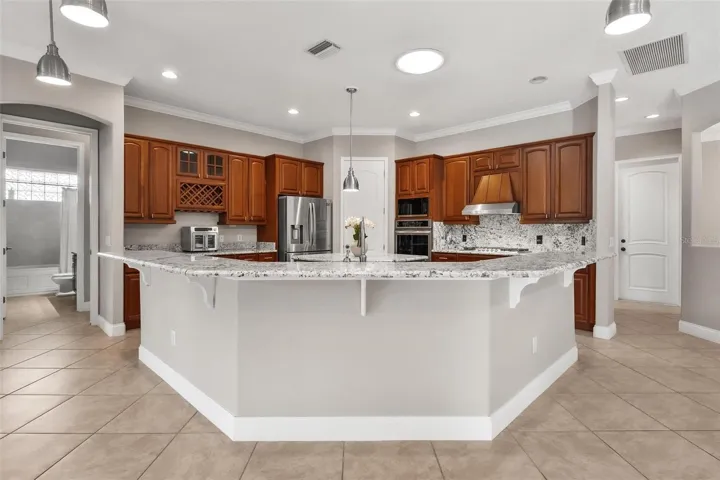 Spacious breakfast bar, beautifully finished with granite countertops that combine style and functionality...