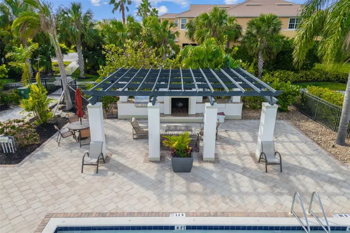 Pergola at Community Pool with Grill and seating area