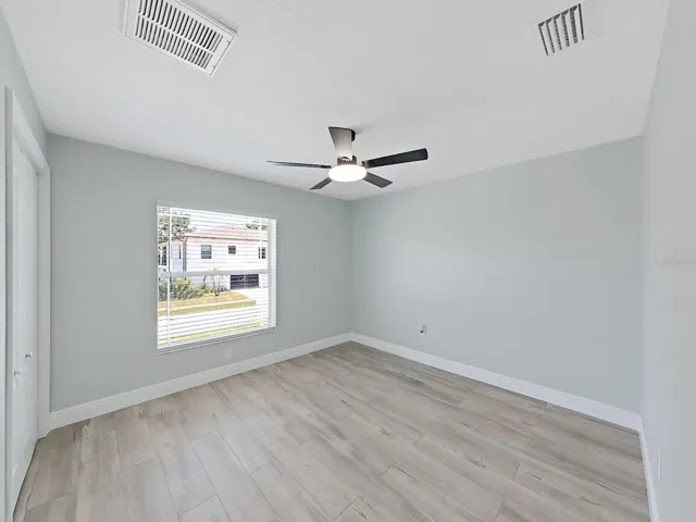 Guest Bedroom 1 with nice high ceilings, new flooring and 6 inch baseboards