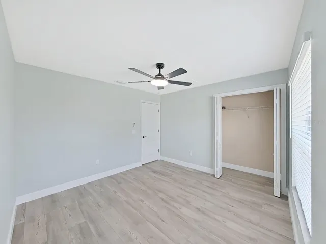 Guest bedroom 2  with nice high ceilings, new flooring and 6 inch baseboards