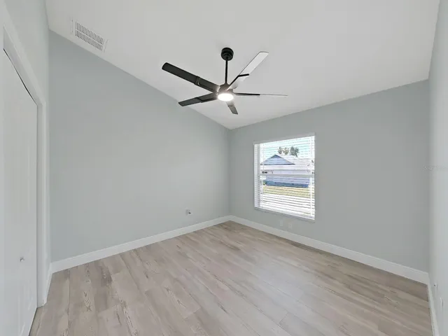 Guest bedroom 2  with nice high ceilings, new flooring and 6 inch baseboards