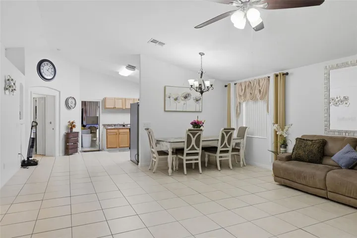 Open concept - dining and living room with elevated ceilings
