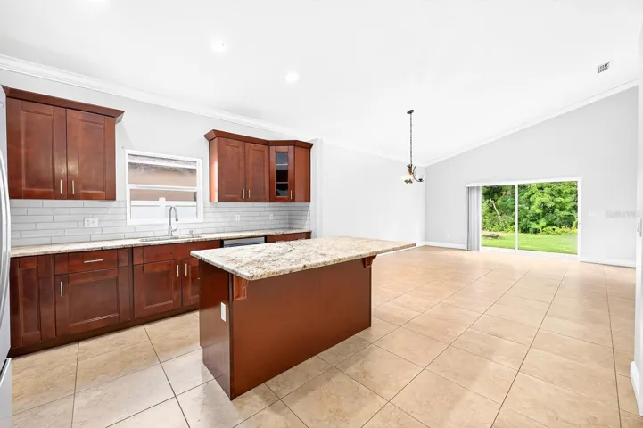 Kitchen is open to a causal dining space and spacious family room.