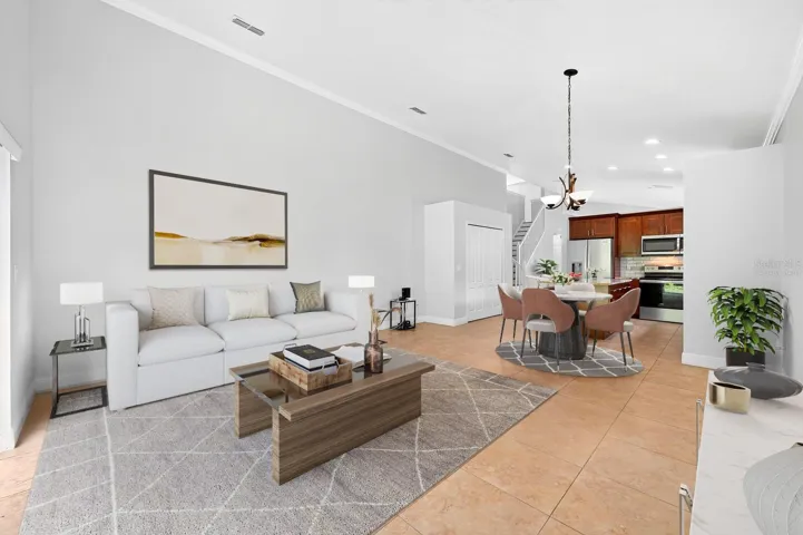 Kitchen is open to a causal dining space and spacious family room. Virtually Staged.