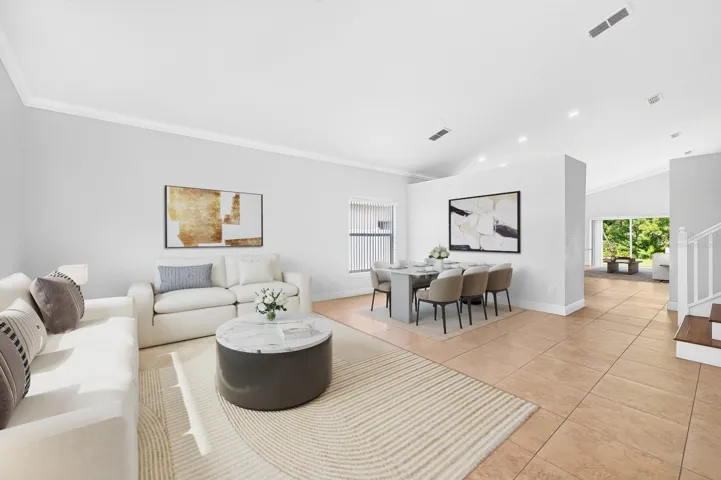 Formal living and dining spaces are great for entertaining. Virtually Staged.