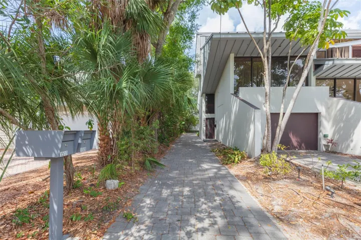 driveway leading to garage (in back)