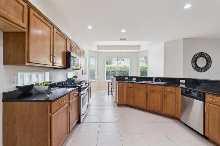 Kitchen w/ exterior glass block inserts underneath cabinets for additional natural light
