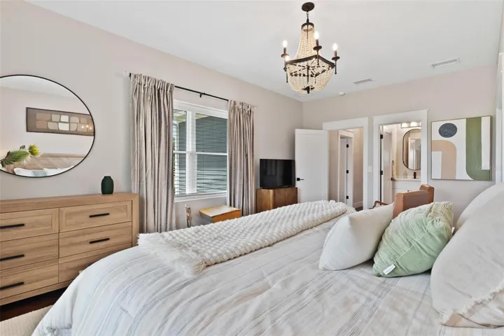 Bedroom #2 features sitting area, Old English Wood flooring, and bathroom with walk in shower.