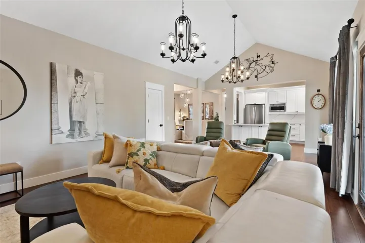 The open-concept design seamlessly blends the living, dining, & kitchen spaces, making the home ideal for entertaining & everyday living.