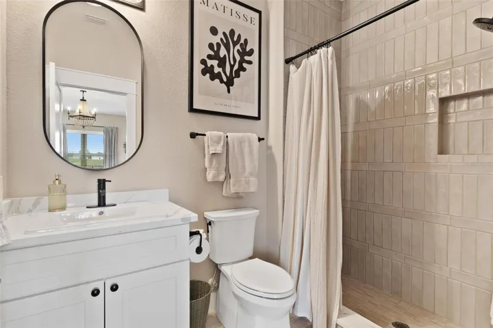 Bathroom #2 features quartz countertops and walk in shower.