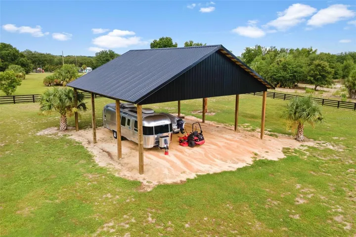 The 40x40 pole barn features a 14-ft clear entry & provides ample room for RVs, boats, & more.