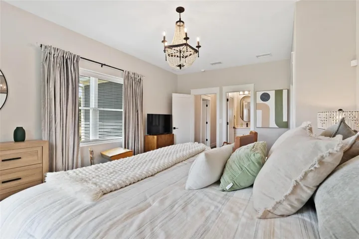 Bedroom #2 features sitting area, Old English Wood flooring, and bathroom with walk in shower.