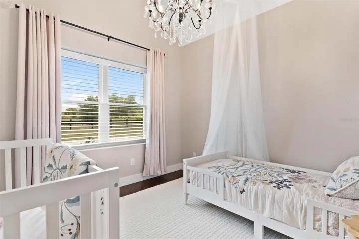 Bedroom #3 features Old English flooring, private bath.