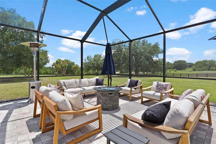 Outdoor living reaches another level w/ the spectacular screened saltwater pool & spa. Spend your days relaxing in the pool, unwind in the hot tub, or gather around one of the 2 fire pits that beautifully frame the spa area