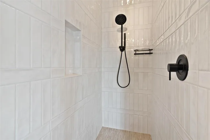 Primary Ensuite features tile walk in shower.