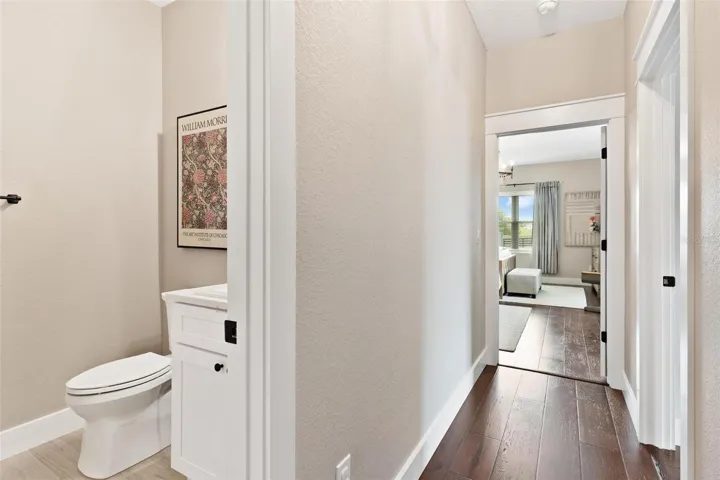 Hallway to 1/2 bath and split floorplan
