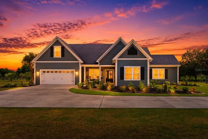 Exterior front of home featues welcoming front porch and exterior built with concrete and Concrete Slate Siding