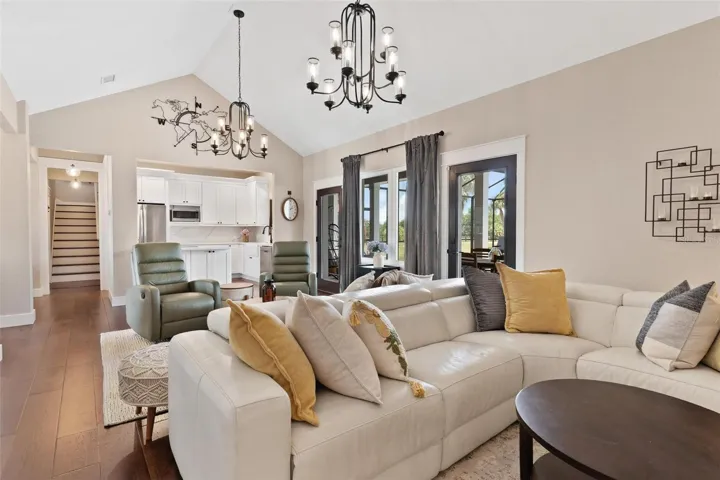 The open-concept design seamlessly blends the living, dining, & kitchen spaces, making the home ideal for entertaining & everyday living.