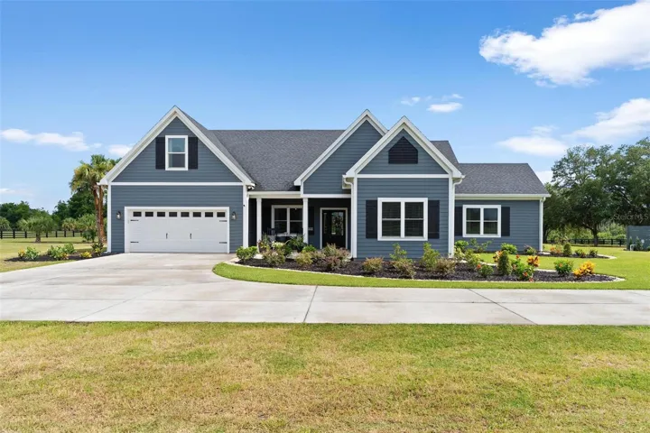 Exterior front of home featues welcoming front porch and exterior built with concrete and Concrete Slate Siding