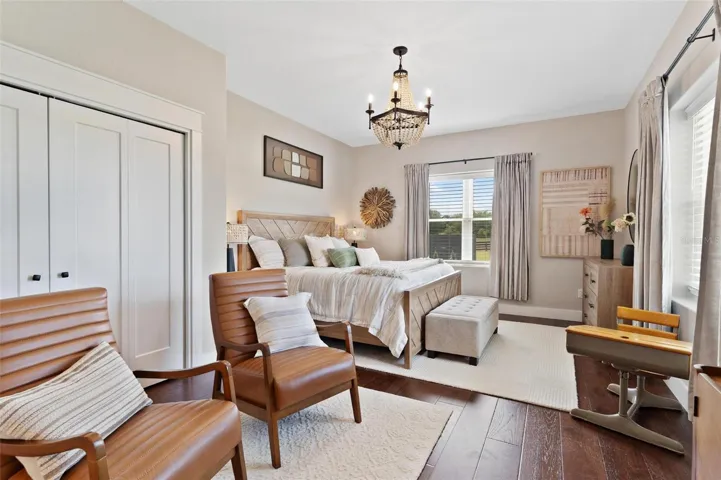 Bedroom #2 features sitting area, Old English Wood flooring, and bathroom with walk in shower.
