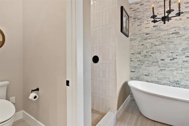 Primary Ensuite features dual vanity sinks with quartz, free standing tub, walk in shower.
