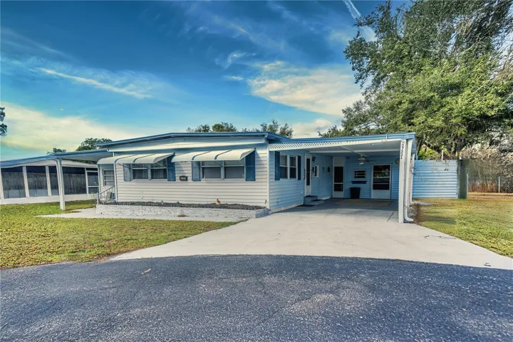 Front of Home w/ Deep 1 car Carport