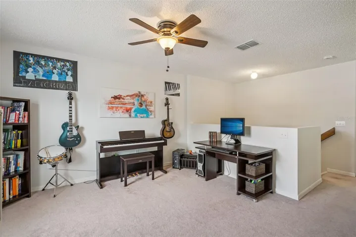 Upstairs flex space currently used as a music room can easily be game room, another office, or 3rd living space.