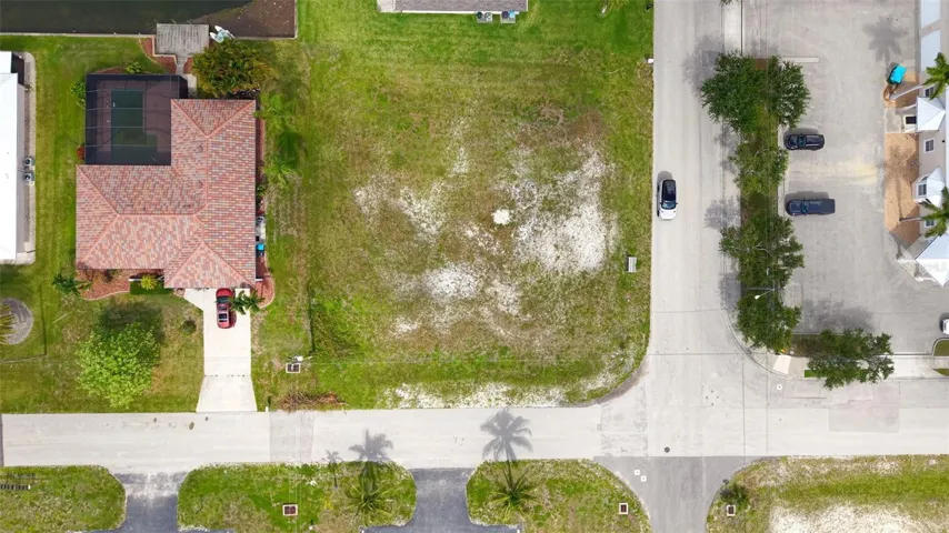 This prime .39-acre waterfront CORNER LOT is the golden ticket your portfolio has been begging for