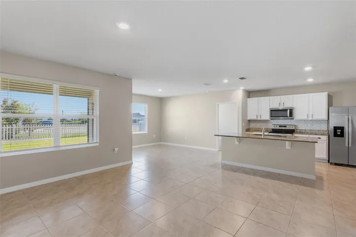 The family room is open to the kitchen, perfect for every day life and entertaining.