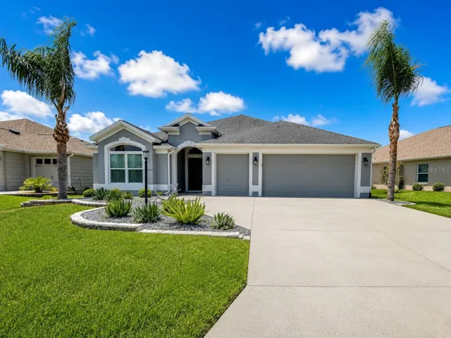 Front of home.  Two car garage with golf cart