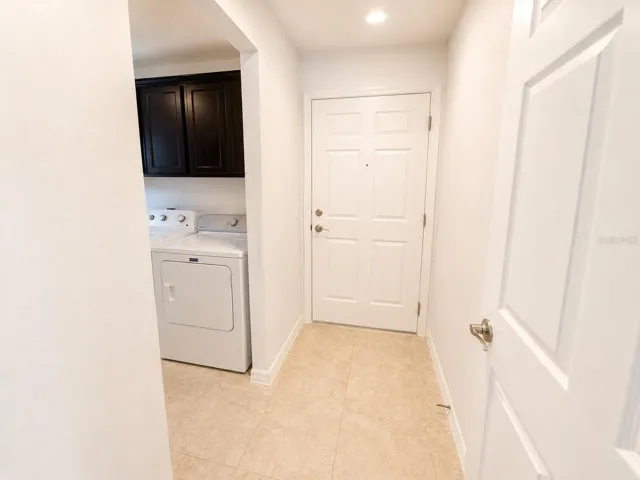 Hallway entering into laundry room and garage