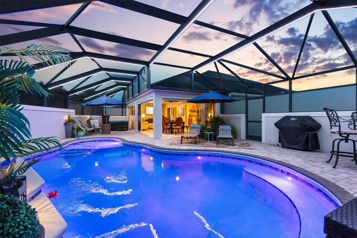 PRIVATE OASIS SURROUNDED BY A STUCCO WALL AND PRIVACY SCREENS