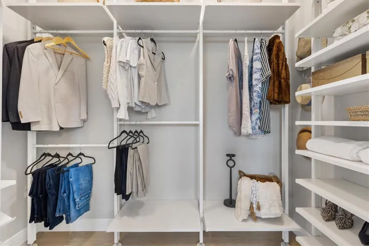 PRIMARY CLOSET WITH BUILT-INS